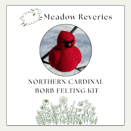 A needle felted Northern Cardinal is in a center circular inset. Above, the brand name Meadow Reveries with a cartoon leaping sheep. Below, NORTHERN CARDINAL BORB FELTING KIT. At the bottom, decorative cartoon wildflowers.